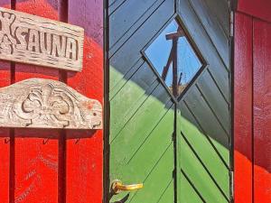 a door with a sign on the side of a building at 5 person holiday home in lyngdal-By Traum in Korshamn