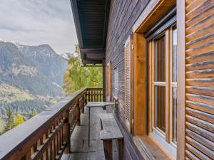 a balcony of a house with a view of mountains at Chalet in Mörtschach near Ski Slopes in Mörtschach