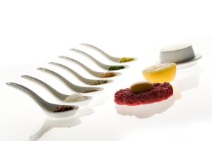 a rendering of a plate of food with different ingredients at Albergo Costantini in Tarcento