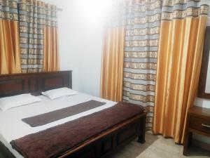 Giường trong phòng chung tại Misty Morning Villa - Ella +4 ảnh