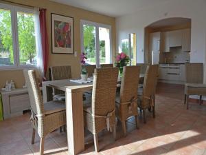 a kitchen and dining room with a table and chairs at House in Piquecos with Private Pool & Garden in Piquecos