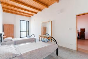 Katil atau katil-katil dalam bilik di Masseria Delle Api