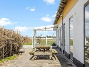 a picnic table on the side of a building at 24 person holiday home in Løkken-By Traum in Grønhøj