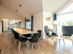 a dining room with a table and chairs at 5 star holiday home in Jerup in Jerup