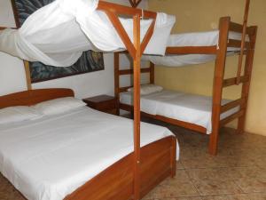 Postel nebo postele na pokoji v ubytování Tambopata Hostel