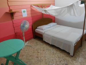Postel nebo postele na pokoji v ubytování Tambopata Hostel