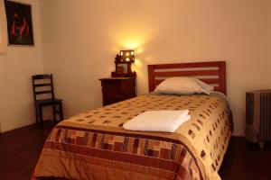 Postel nebo postele na pokoji v ubytování Emperatriz Guest House + 5 fotografií