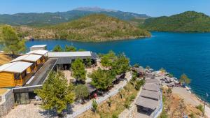 an aerial view of a building next to a lake at Bujtina Sarda in Rragam