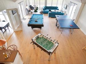 two ping pong tables in a living room at 5 star holiday home in Grenaa in Grenå +41 photos