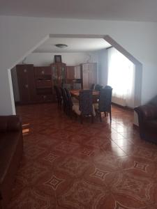 a dining room with a table and chairs at Casa Cornelia in Bran