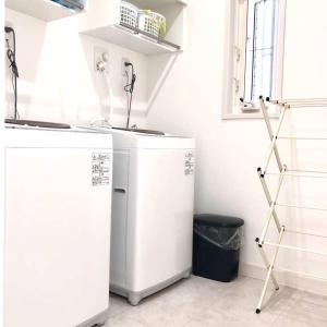 two white refrigerators in a room with a window at Putao in Osaka +10 photos