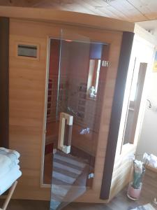 a glass door of a room with a stairway at Haus Vögel in Sibratsgfäll +42 photos