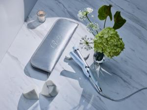 a table with a book and a pen and a vase of flowers at Tokyu Stay Sapporo in Sapporo +89 photos