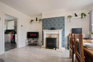a living room with a fireplace and a tv at poplar in Mexborough