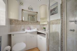 a bathroom with a toilet and a sink and a shower at poplar in Mexborough +29 photos