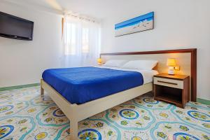 Postel nebo postele na pokoji v ubytování Daisy penthouse