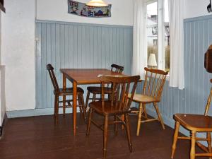 a dining room with a table and chairs at 5 person holiday home in KALVSVIK in Kalvsvik