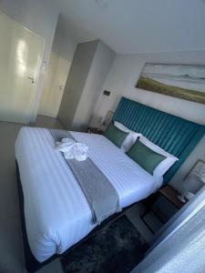 Katil atau katil-katil dalam bilik di LincVilla Apartment +16 gambar
