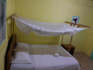 Postel nebo postele na pokoji v ubytování Tambopata Hostel