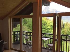 a screened in porch with a view of a mountain at Chalet in Schruns near Montafon Ski Lift in Schruns