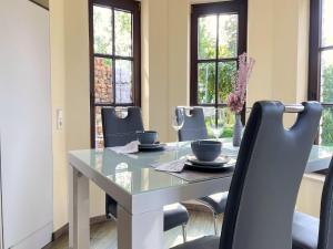 a dining room with a table and chairs at Ferienwohnung in Madfeld in Madfeld