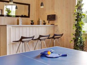 a table with a plate of food on top of it at 5 star holiday home in Bogense in Bogense