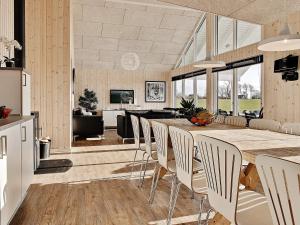 a kitchen and living room with a table and chairs at 5 star holiday home in Bogense in Bogense