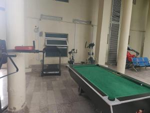 a room with a pool table and some exercise equipment at Marina Apartments in Lagos