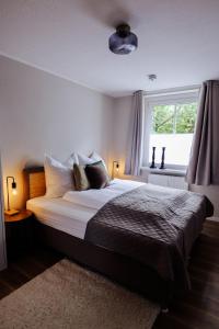 Ένα ή περισσότερα κρεβάτια σε δωμάτιο στο Modern, 4Pers, nahe S-Bahn - salt apartments