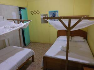 Postel nebo postele na pokoji v ubytování Tambopata Hostel
