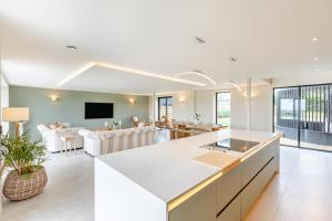 an open kitchen and living room with a couch at 5 Bed in Marwood oc-e32631 in Marwood