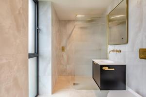 a bathroom with a sink and a shower at 5 Bed in Marwood oc-e32631 in Marwood +46 photos