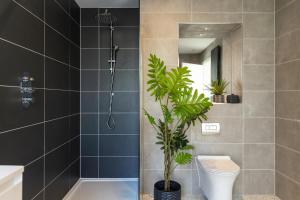 a bathroom with a shower and a toilet and a plant at 7 Bed in Marwood oc-w32673 in Marwood +31 photos