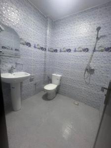 a bathroom with a toilet and a sink at Résidence Atlantic in Agadir +17 photos