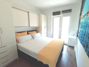 a bedroom with a bed and a large window at Istrian Azure in Pula +7 photos