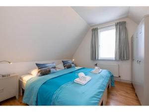 Giường trong phòng chung tại Holiday home with sun terrace facing south-pet-friendly