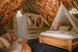 En eller flere senge i et værelse på The Jungle Pearl Resort + 72 billeder