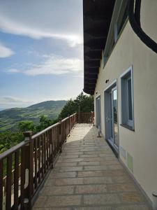a wooden walkway next to a building with a view at La Magia Lucana in Colobraro