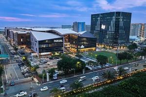 a city with buildings and a street with cars at Sybay suites near okada MOA airport NAIA COD Manila in Manila