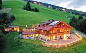 an aerial view of a large house on a hill at Residenz Erschbaum in Valdaora
