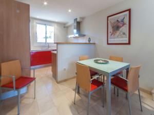 a kitchen and dining room with a table and chairs at Sunny Terrace Near Beach in L'Escala +32 photos