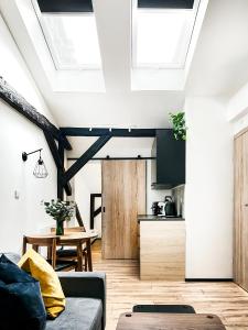 a living room with a couch and a table at Apartment Premium Jacuzzi, Old Town Cracow in Kraków +28 photos