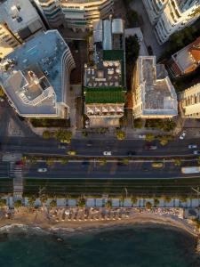 an aerial view of a city with buildings and a street at Coral Hotel Athens in Athens