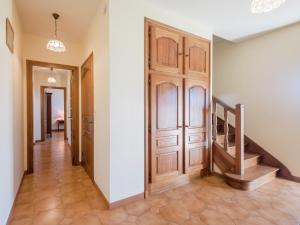 a hallway with a wooden door and stairs at Labardamier Garden Home in Villefranche-du-Périgord +21 photos
