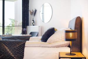 Ένα ή περισσότερα κρεβάτια σε δωμάτιο στο Luxurious apartment near the beach in Pobierowo +31 φωτογραφίες