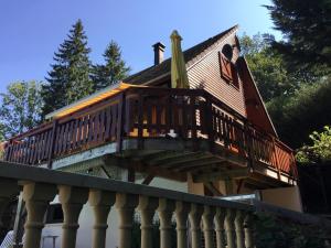 a large deck on the side of a house at Poolside Bliss Near Lake in Beaulieu