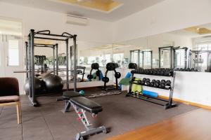 a gym with a lot of equipment in a room at Luxury 4bhk villa with party hall in Chennai