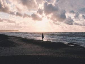a person standing on a beach with the ocean at 6 person holiday home in Brovst in Brovst +116 photos