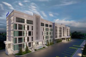 a rendering of a large white building at Radisson Blu Hotel, Almaty Airport in Almaty