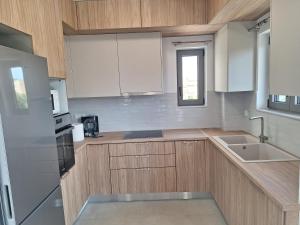 Η κουζίνα ή μικρή κουζίνα στο Kalamata Modern Apartment +13 φωτογραφίες